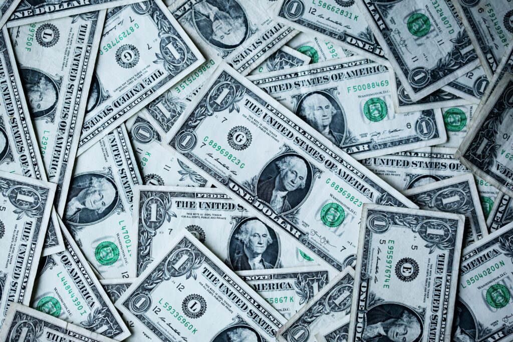 one dollar notes placed next to each other | Can AI be trusted to battle money laundering and fraud